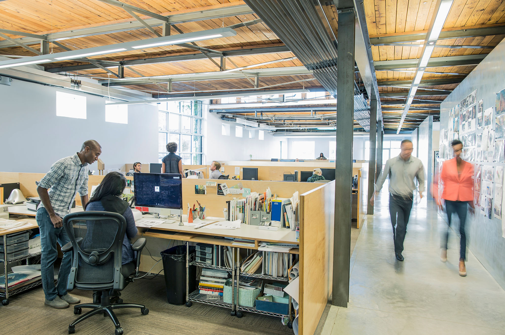 People in an open concept office space