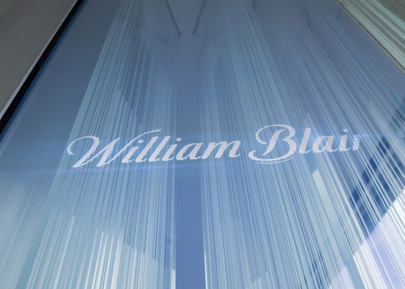 William Blair logo etched on a glass wall